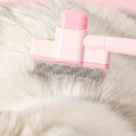 Peinilla con botón para perros y gatos